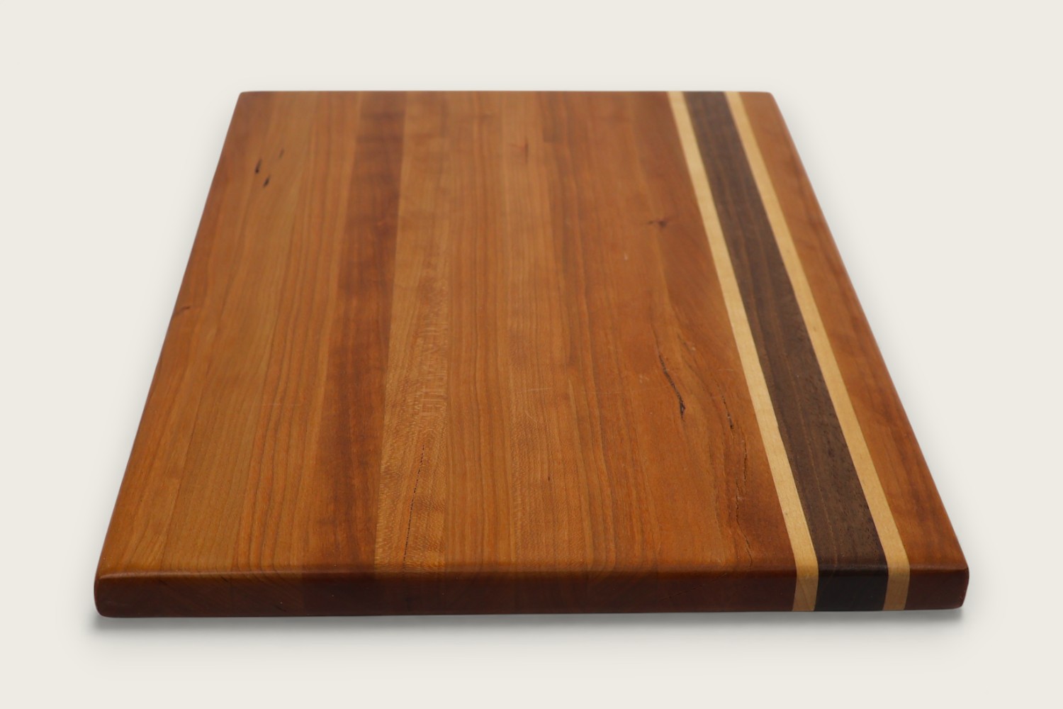 Cherry Hearthwood Serving Board (#235) with edge-grain cherry wood, horizontal pattern, and warm amber tones.